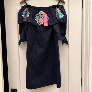 NWT “Vanessa Dress” is an off the shoulder dress with beautiful embroidery!